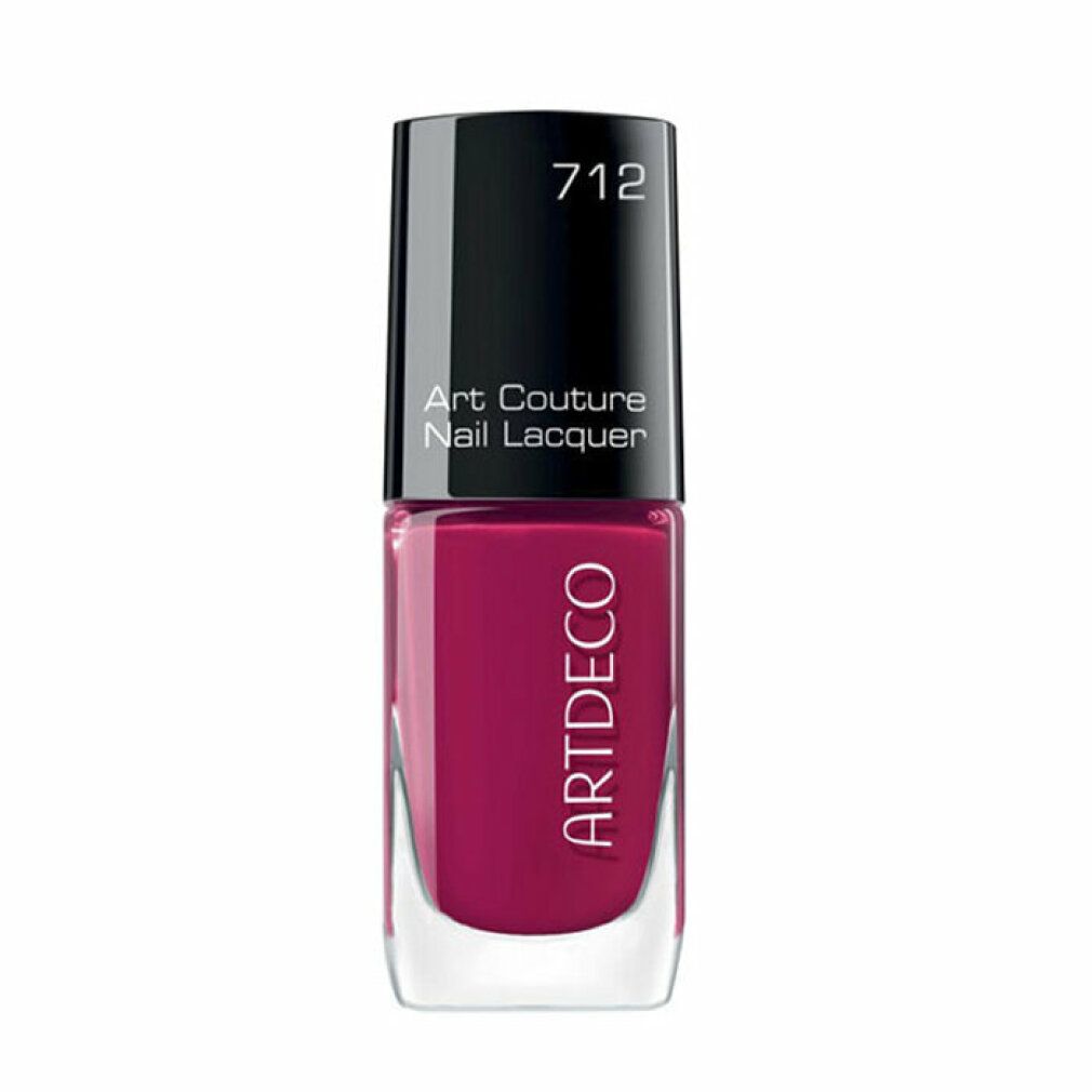 Nagellakfles met zwarte dop. Opschrift: Art Couture Nail Lacquer, ARTDECO. Kleur 712, roze.
