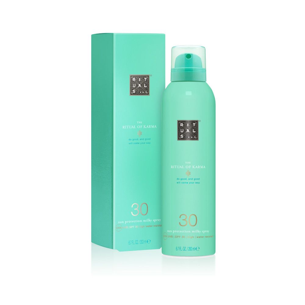 Spray turquoise et emballage. Inscription: Rituals, The Ritual of Karma, 30, spray de lait solaire.