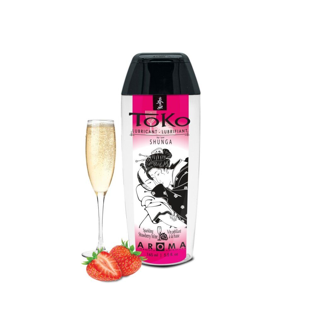 Bouteille de lubrifiant Toko Shunga avec fraises et coupe de champagne. Motif japonais sur la bouteille.