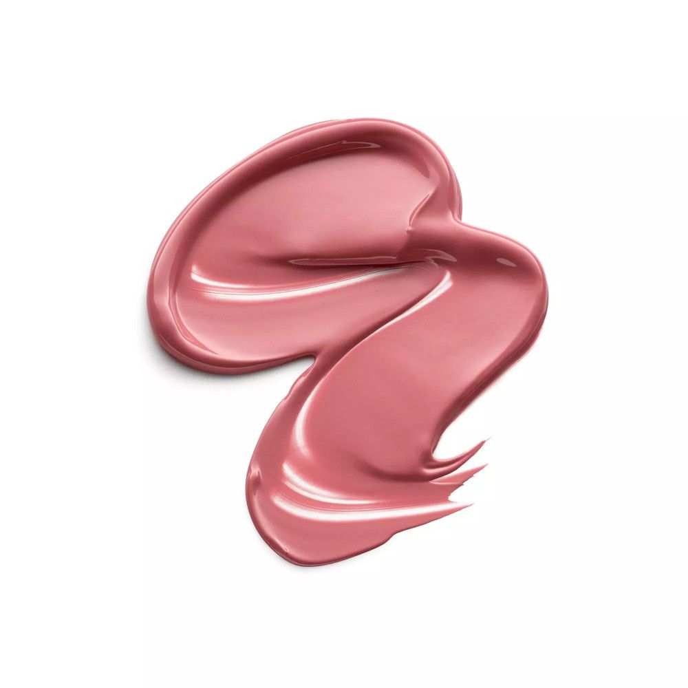 Échantillon de rouge à lèvres rose sur fond blanc. Texture brillante.