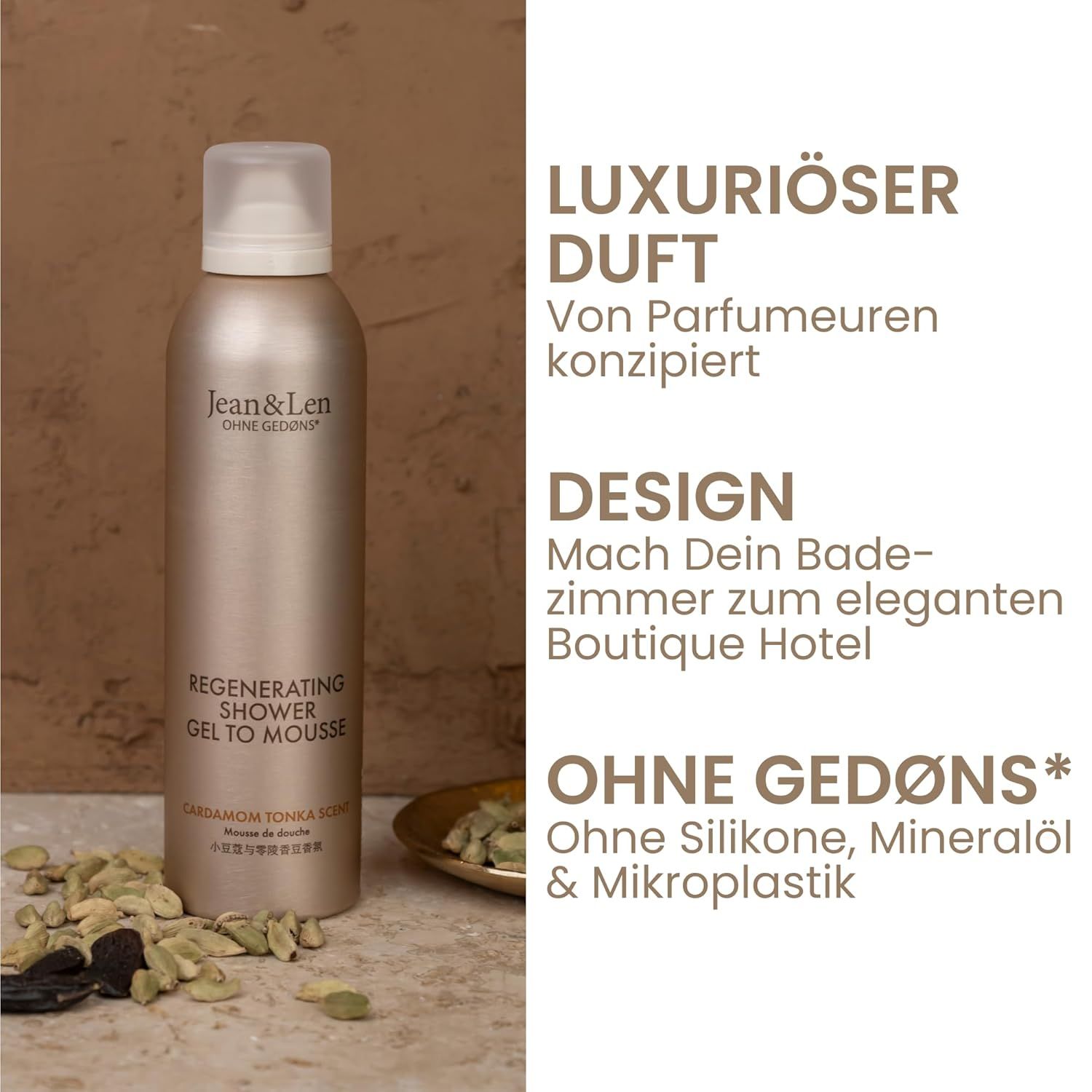 Beige fles met witte dop. Tekst: Jean & Len, Regenerating Shower Gel To Mousse, Cardamom Tonka. Kruiden ernaast.