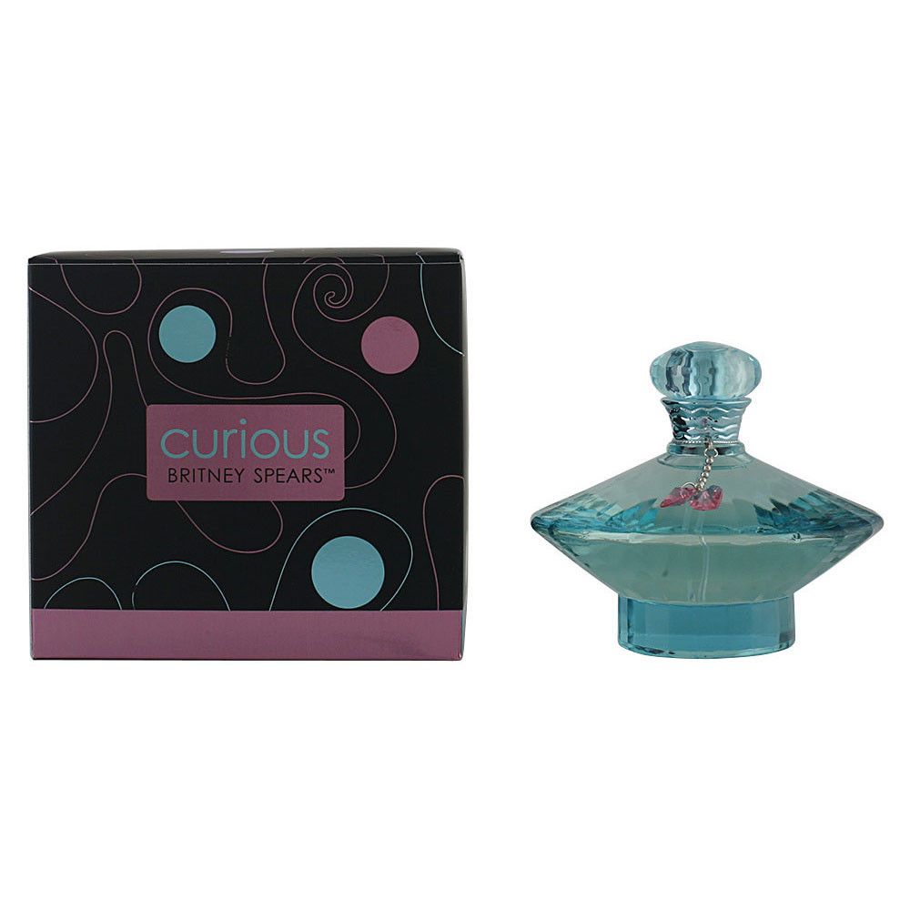 Flacon de parfum bleu et boîte. La boîte porte l'inscription "Curious Britney Spears".