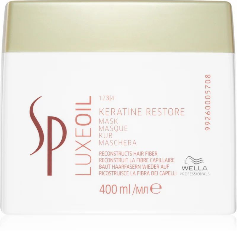 Pot blanc avec couvercle doré. Inscription : Keratin Restore Mask, Wella SP Luxeoil. 400 ml.
