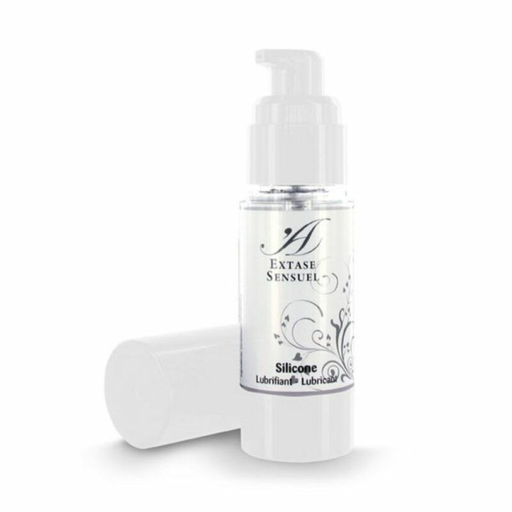Flacon avec pompe doseuse, bouchon posé à côté. Étiquette 'Extase Sensuel Silicone Lubricant'.