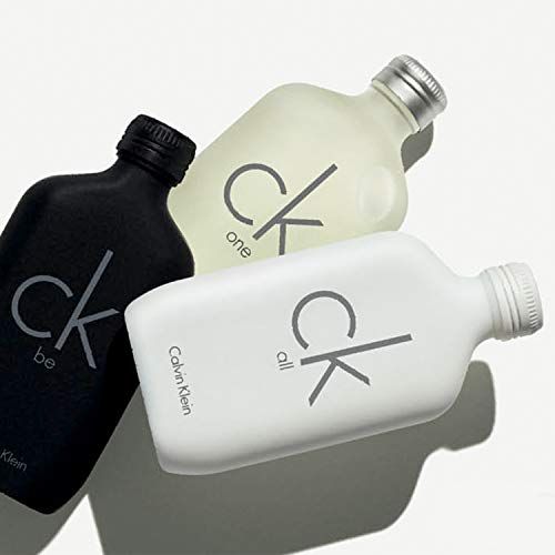 Trois bouteilles de parfum Calvin Klein : CK All (blanc), CK One (jaune), CK Be (noir).