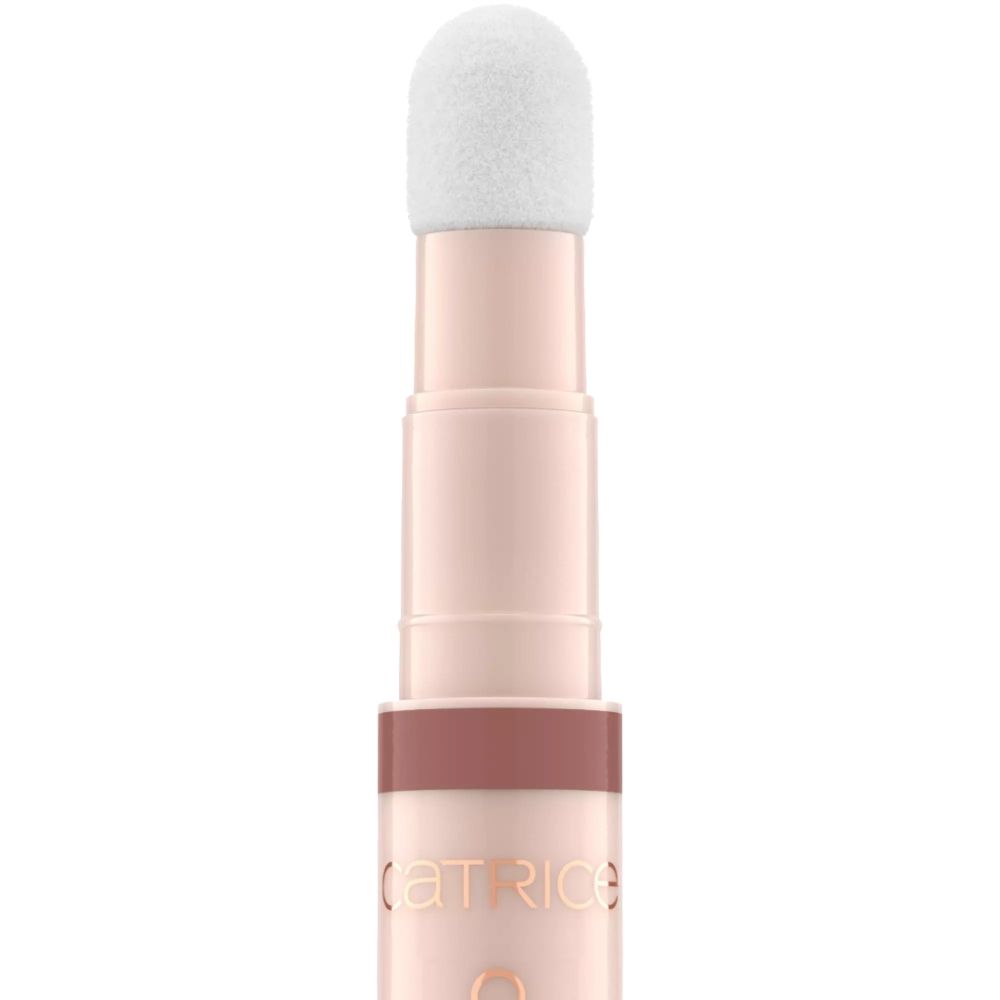 Lipolie met applicator. Tekst: COLOUR CUSHION JUICY LIP OIL. Roze pen met witte applicator. Merk: CATRICE.