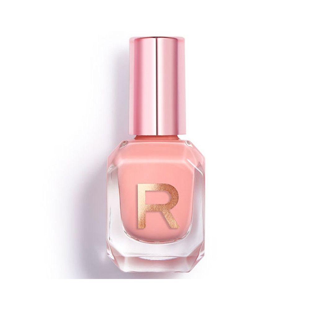 Een lichtroze nagellak in een zeshoekig glazen flesje met een goudkleurig 'R'-logo en een roségouden dop.