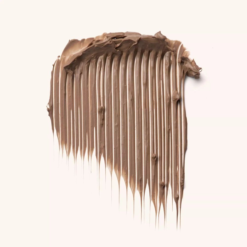 Bruine mascara-textuur op lichte achtergrond. Streepjespatroon met fijne punten.