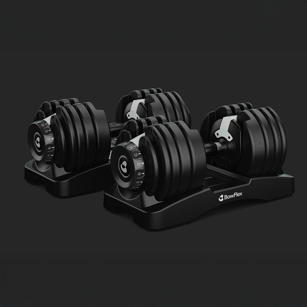 Deux haltères Bowflex SelectTech sur des bases noires, avec poids réglables.