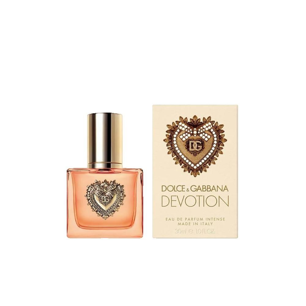 Parfumfles en doos. Fles met hartdecoratie. Opschrift: Dolce & Gabbana Devotion Eau de Parfum Intense. Made in Italy.