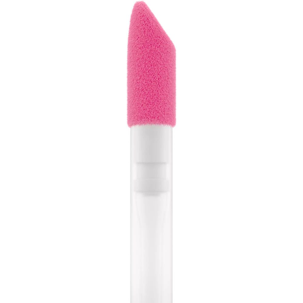 Close-up van de applicator. Roze spons tip op witte steel.