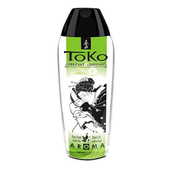 Bouteille de lubrifiant Toko avec bouchon noir et étiquette verte ornée d'une illustration japonaise.