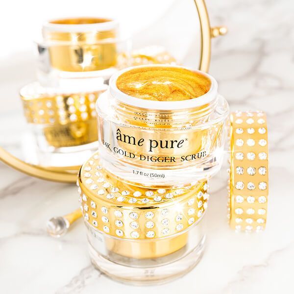 Plusieurs pots de gommage 24K Gold Digger, couvercles scintillants.