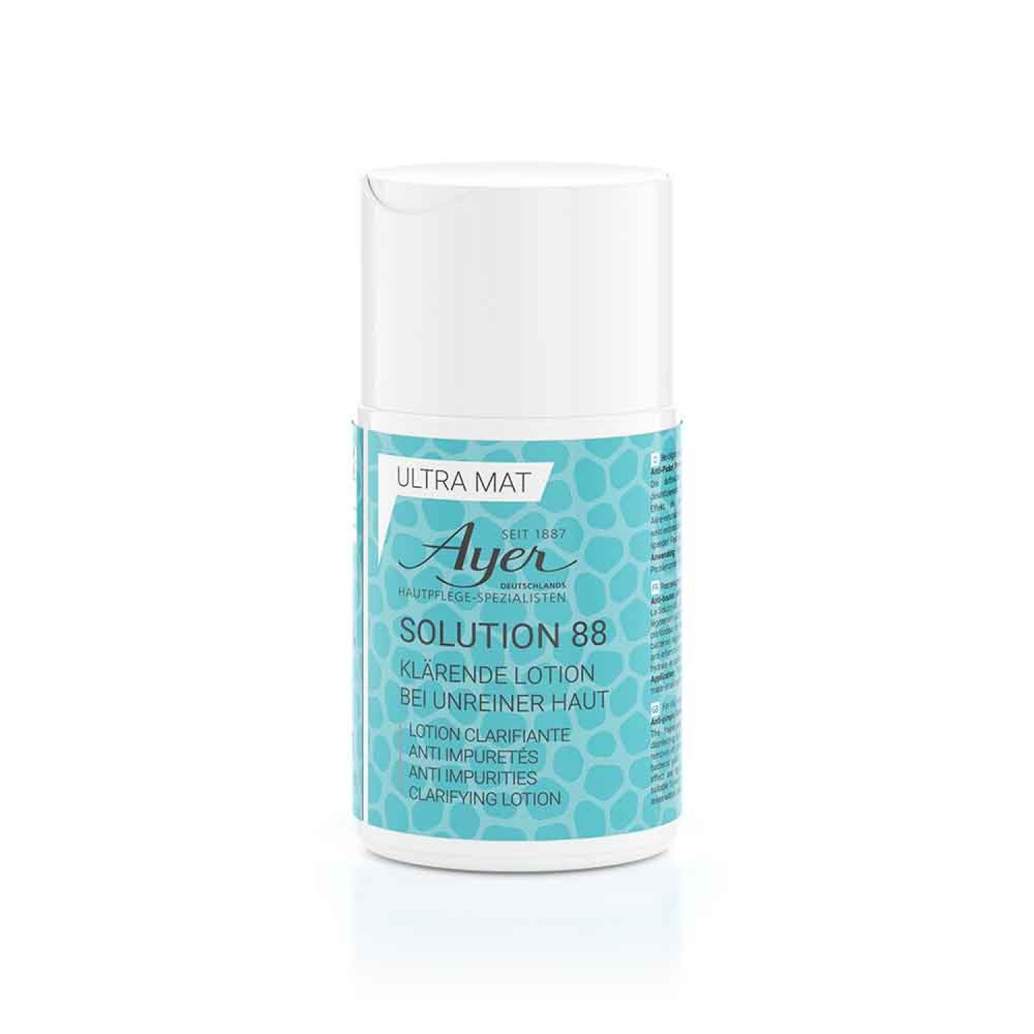Flacon cylindrique à bouchon blanc et étiquette turquoise. Inscription : Ayer, Solution 88, lotion clarifiante.