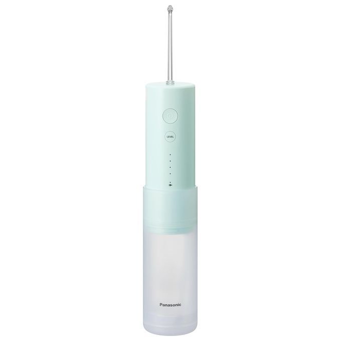 Hydropulseur dentaire vert menthe. Corps cylindrique avec buse et boutons. Réservoir transparent en bas. Marque : Panasonic.