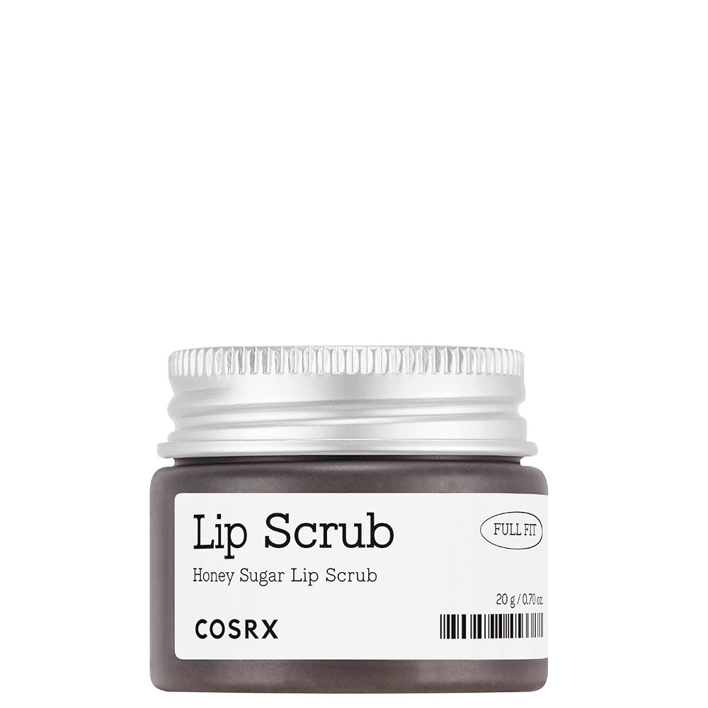 Een klein potje met zilverkleurig deksel, gelabeld "Lip Scrub Honey Sugar Lip Scrub COSRX".