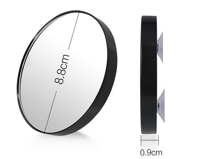 Miroir grossissant noir, 8,8 cm de diamètre, 0,9 cm d'épaisseur, avec deux ventouses.