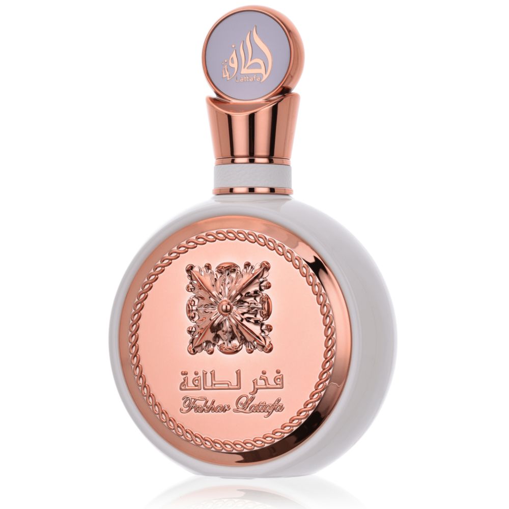 Flacon de parfum rond blanc avec des accents or rose et un médaillon orné.