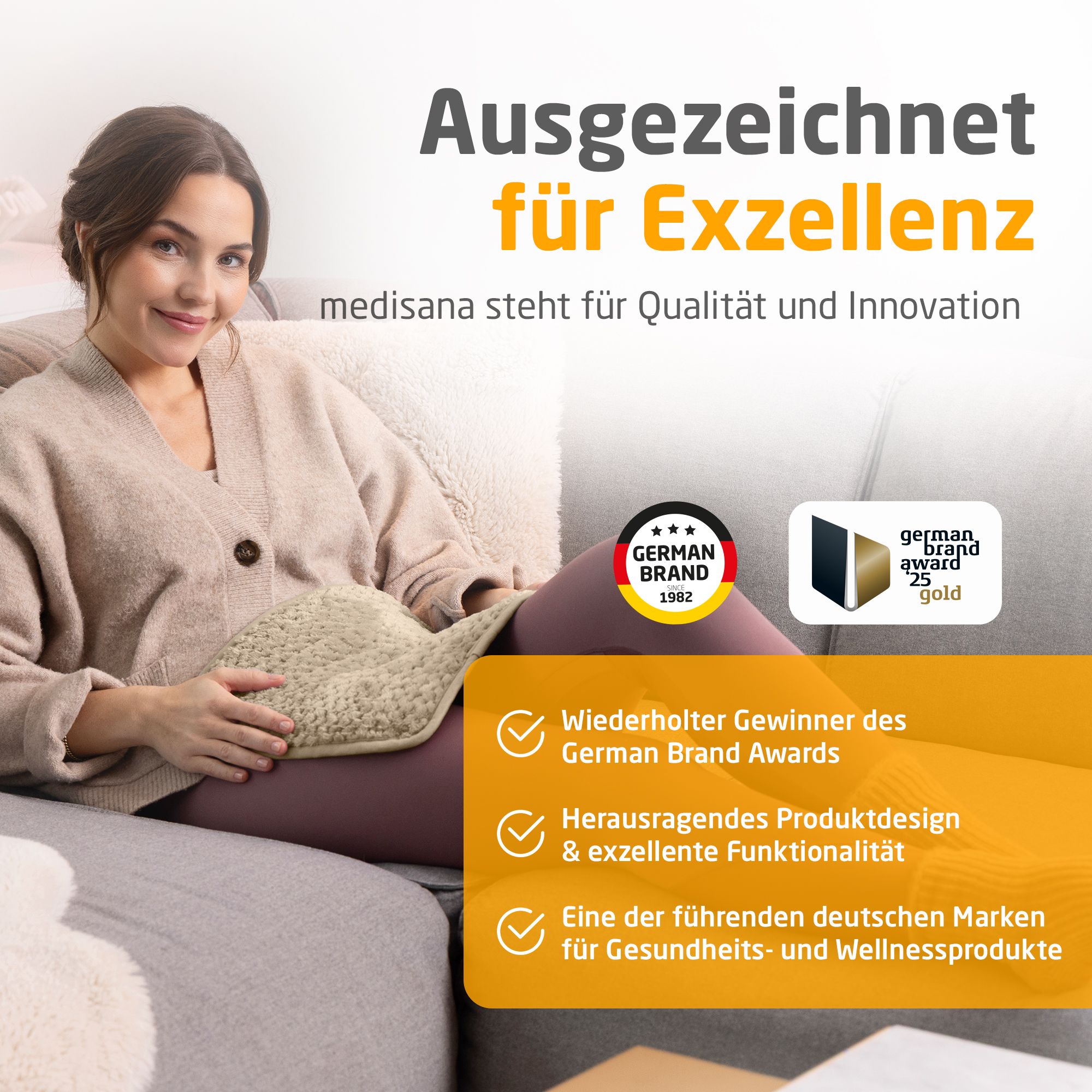 Femme sur canapé avec coussin chauffant. German Brand Award. German Brand Award 25 gold. Gagnant répété.