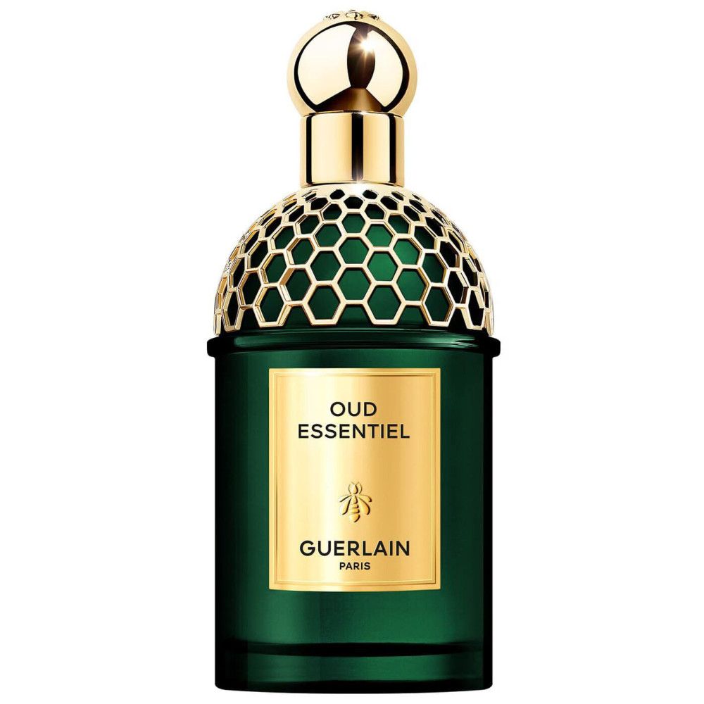 Flacon de parfum vert avec bouchon et texte dorés. Inscription "Oud Essentiel" et "Guerlain Paris".