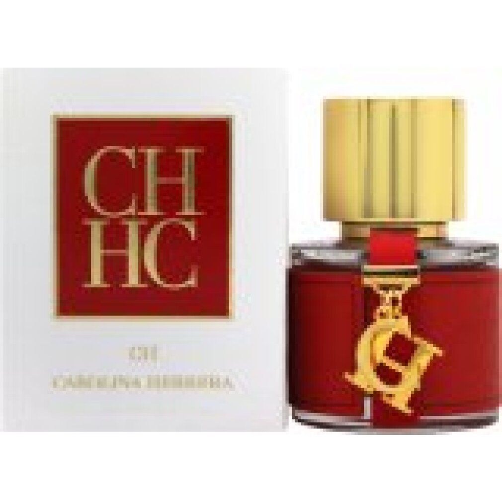 Flacon rouge avec bouchon doré et breloque. Boîte blanche avec logo et texte rouges.