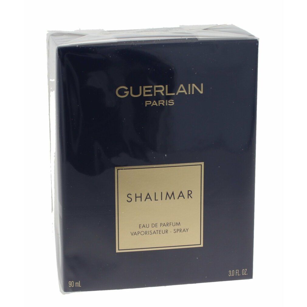 Boîte bleu foncé avec nom de produit et de marque. Inscription: Guerlain Paris, Shalimar Eau de Parfum.