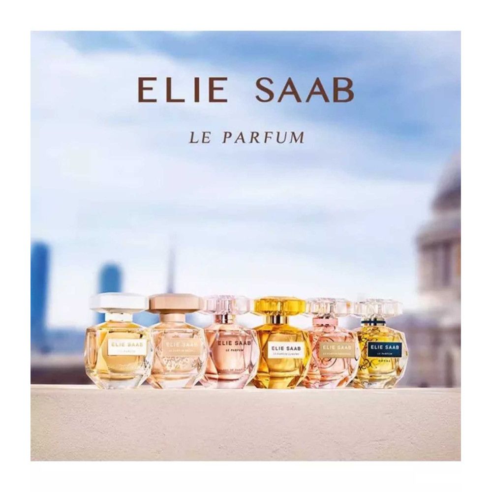 Verschillende parfumflesjes. Opschrift: Elie Saab, Le Parfum. Verschillende vormen en kleuren, voor blauwe lucht.