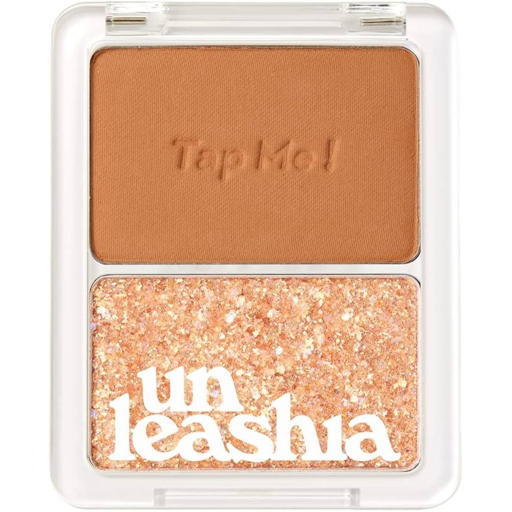 UNLEASHIA Tap Me Palette Duo. Twee tinten in een transparante verpakking. Tekst: Tap Me!, Unleashia. Bruine en glitter tinten.