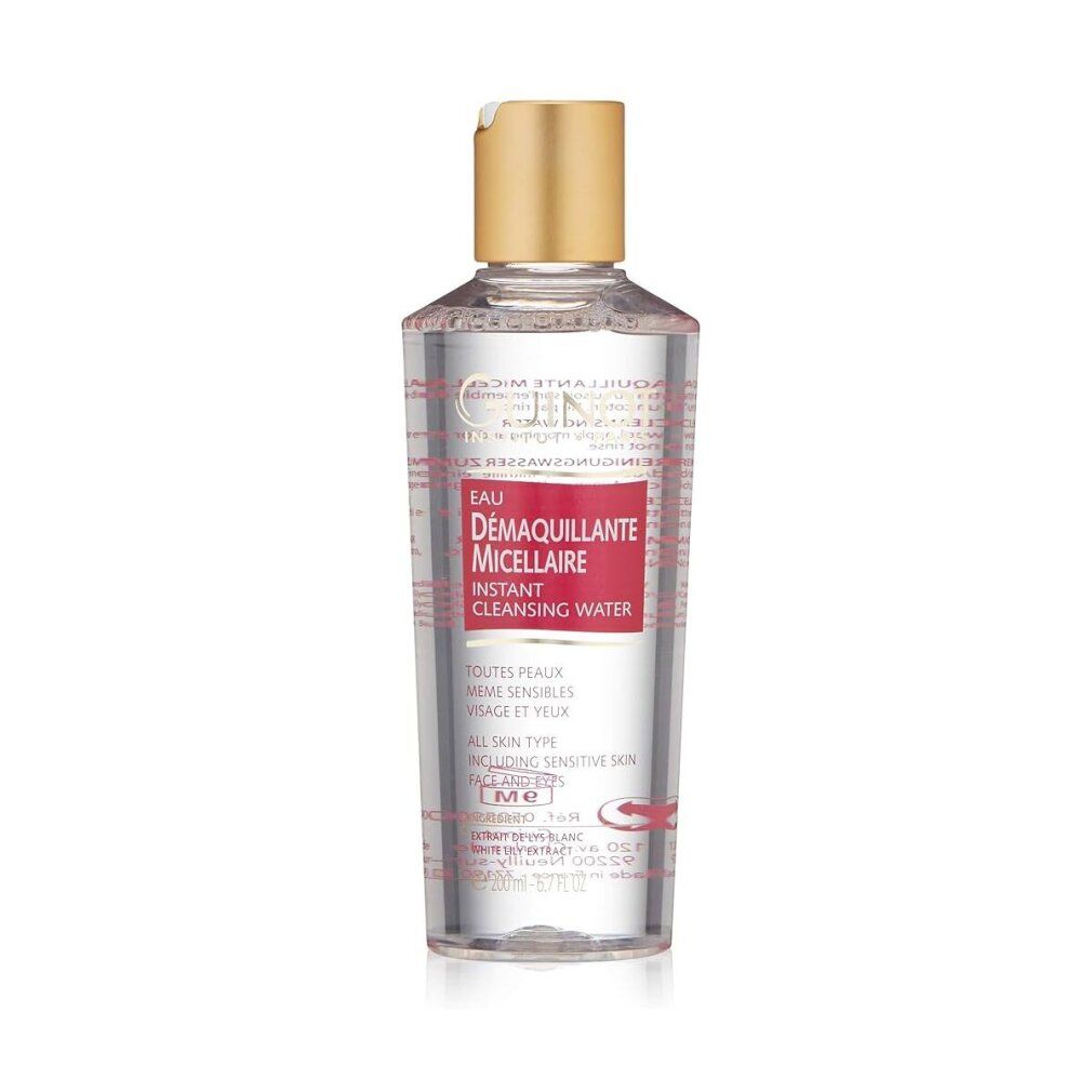 Flacon transparent avec bouchon doré. Étiquette rouge avec texte: Eau Demaquillante Micellaire Instant Cleansing Water. Logo Guinot.