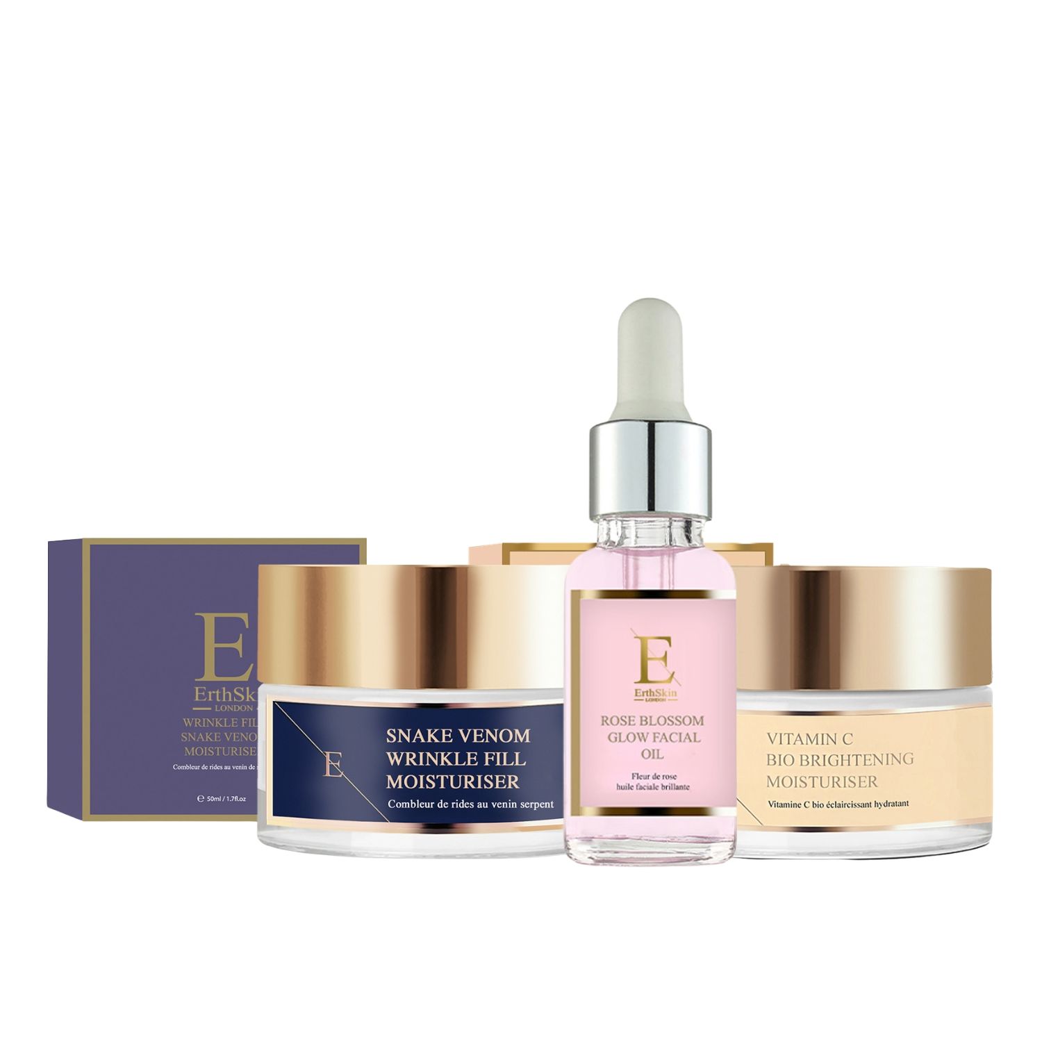 Ensemble de soins pour la peau. Pots et flacon en verre. Couvercles dorés, étiquettes bleues et beiges. Marque visible.