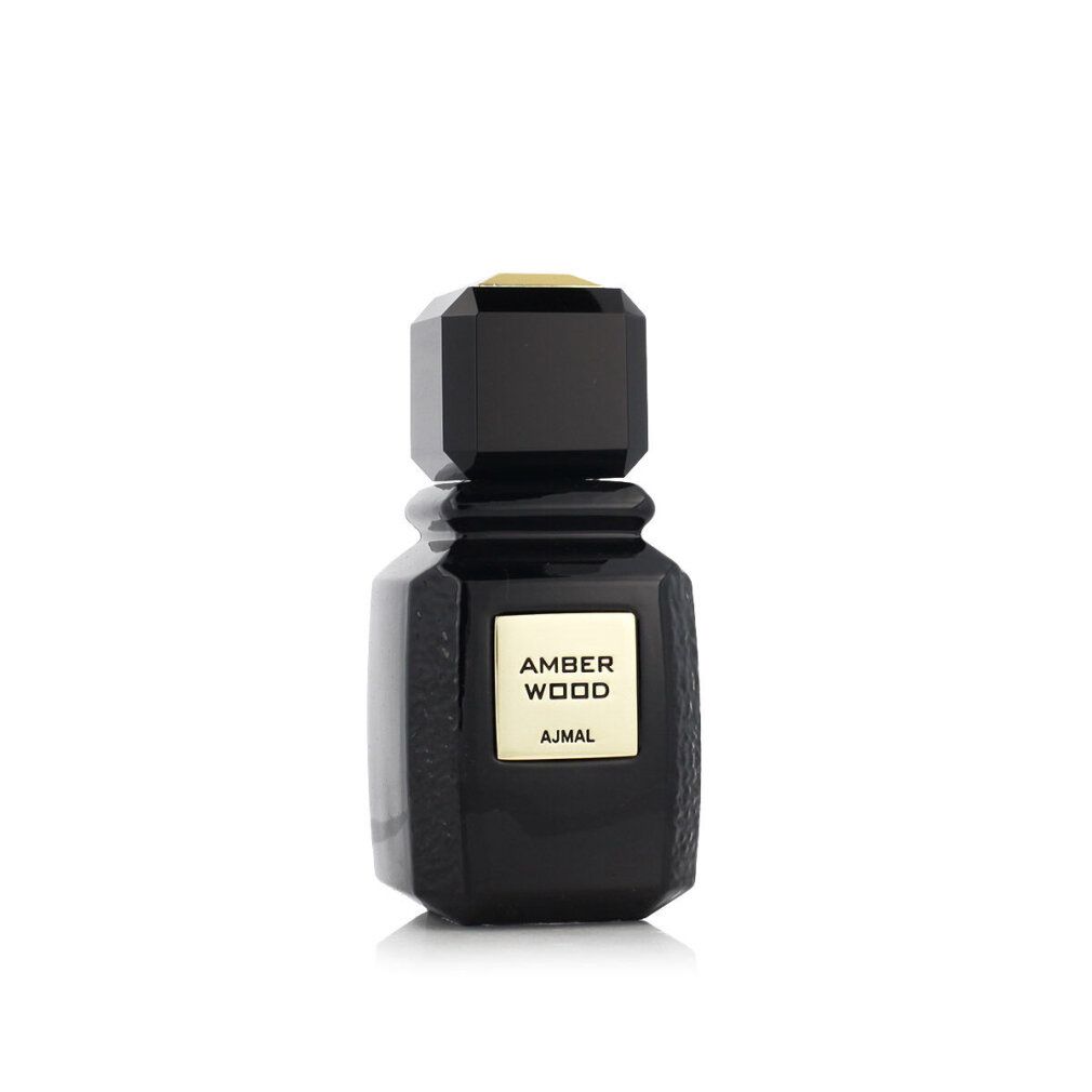 Flacon noir avec étiquette dorée AMBER WOOD et AJMAL. Bouchon angulaire.
