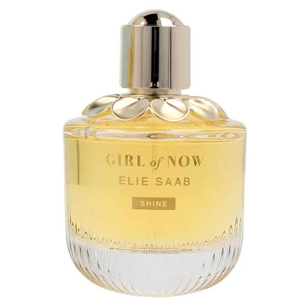 Flacon de parfum avec bouchon doré. Flacon avec liquide jaune pâle. Texte: Nom et Shine. Flacon en verre avec design floral.