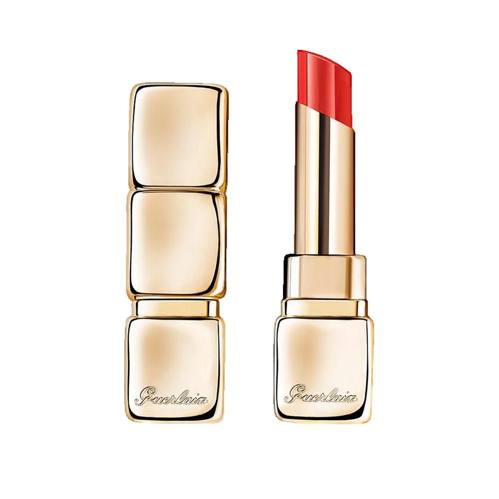 Lipstick in gouden huls, geopend. Rode lipstickstift zichtbaar. Merk Guerlain.