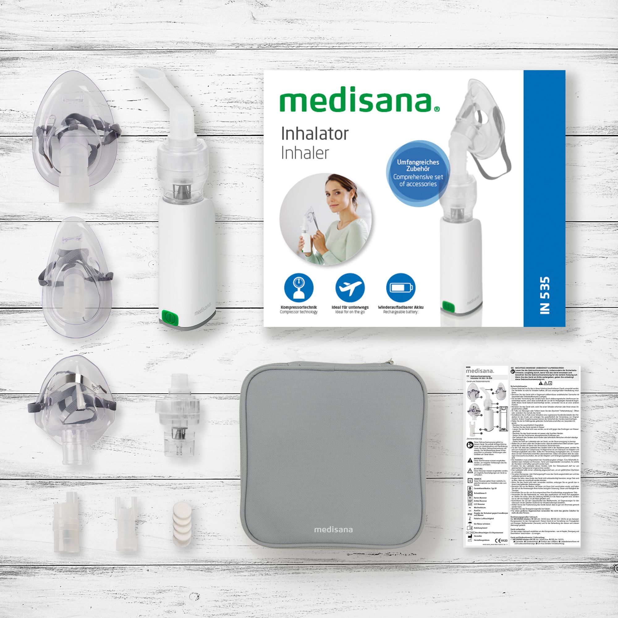 Medisana Inhalator IN 530 met accessoires: maskers, mondstuk, etui en handleiding.