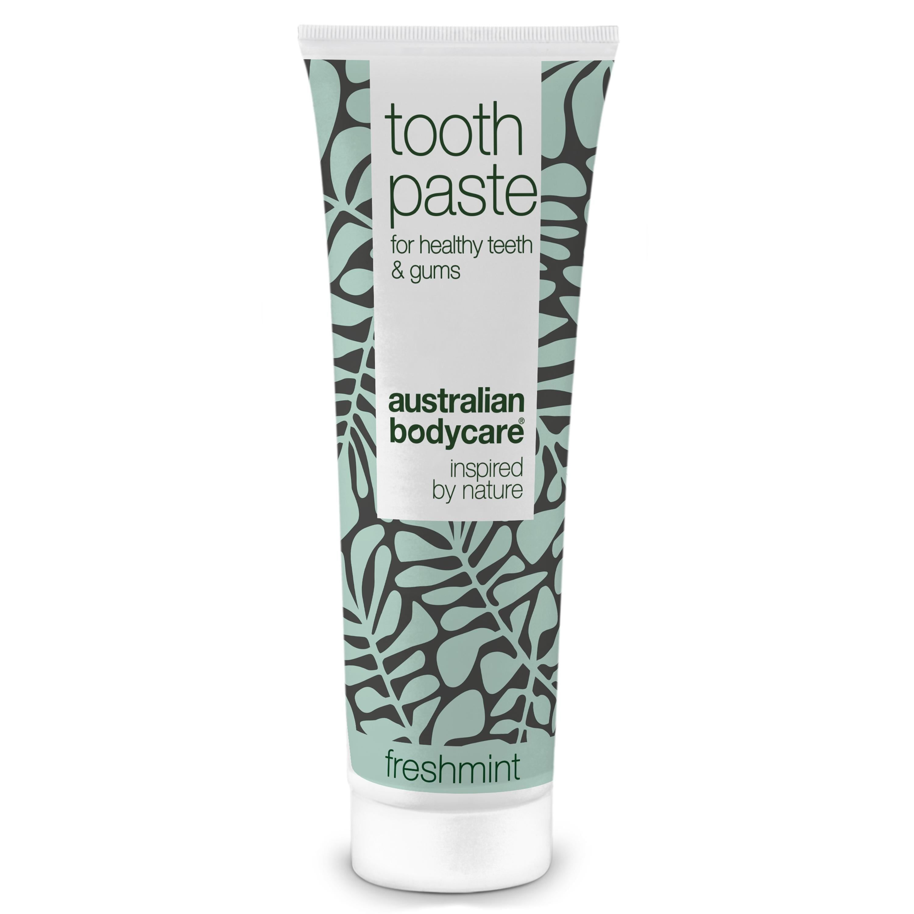 Tandpastatube met bloemenpatroon. Tekst: Toothpaste, voor gezonde tanden & tandvlees, Australian Bodycare, Freshmint.