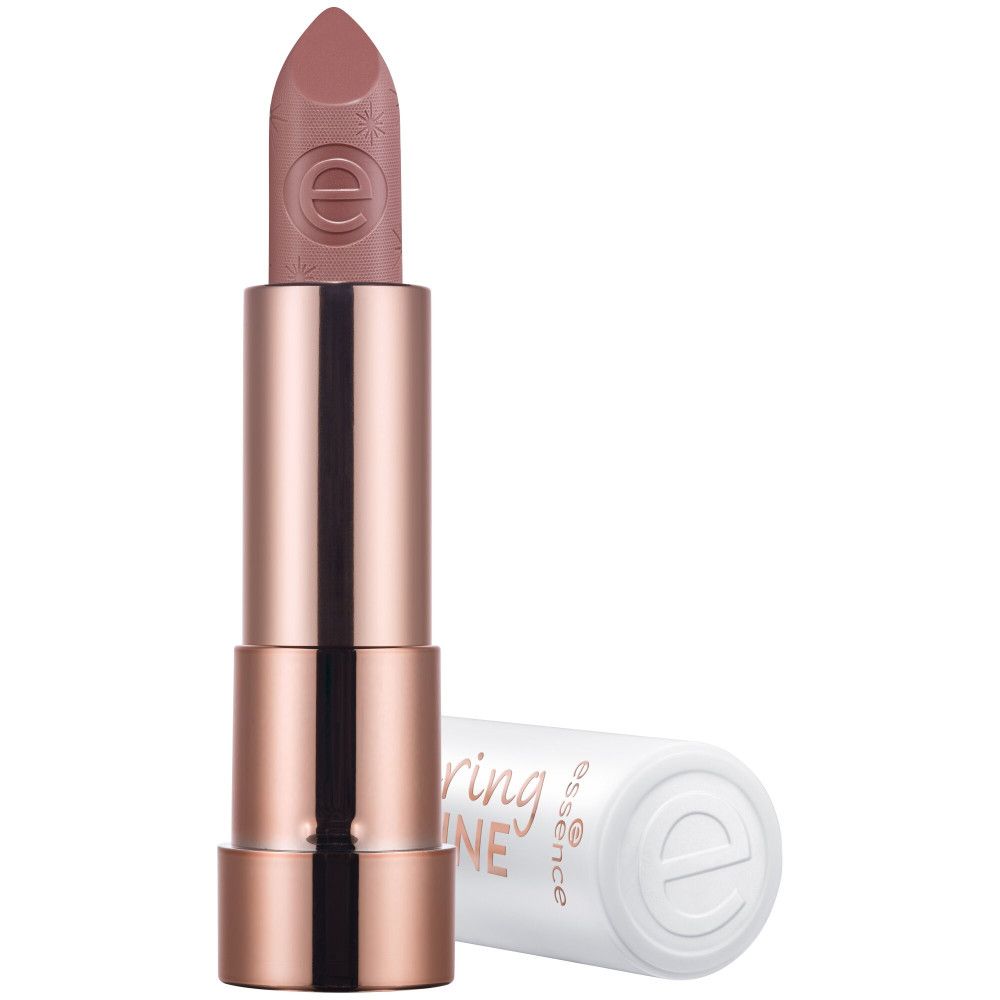 Rouge à lèvres ouvert. Étui blanc, base cuivrée. Inscription: Caring Shine, logo Essence. Rouge à lèvres rose.