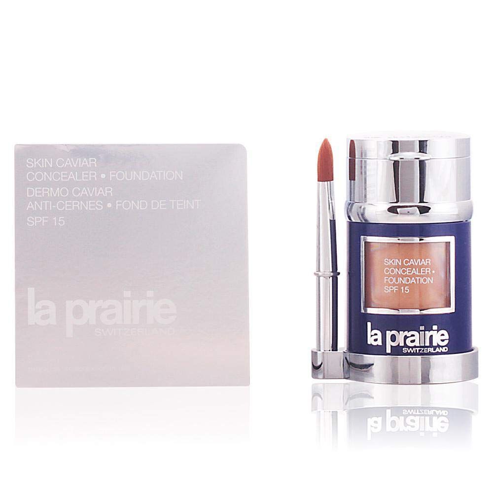 La Prairie Skin Caviar Foundation, Sunset Beige. Récipient bleu, capuchon argenté, pinceau. Emballage avec informations produit.