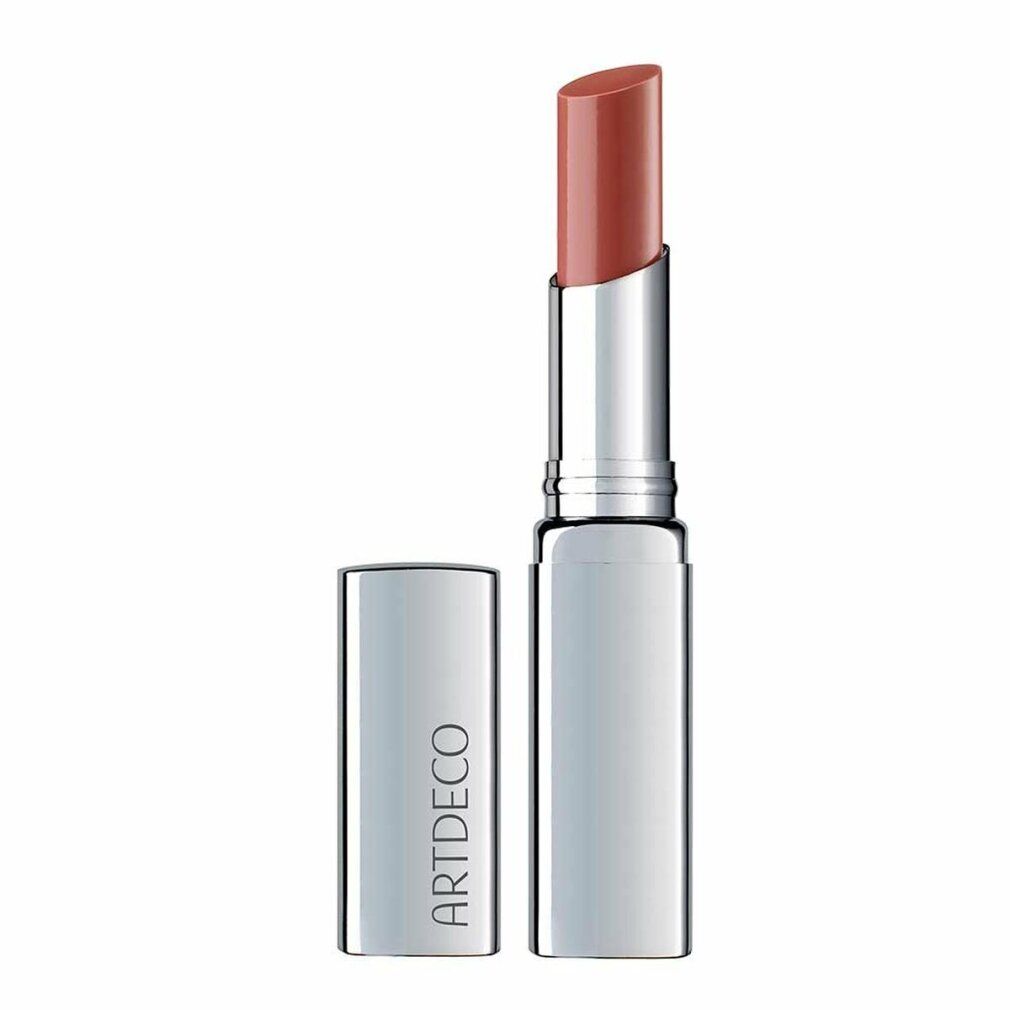 Lipbalsem met zilveren huls en open dop. De lipstick heeft een warme roze tint. "ARTDECO" staat op de huls.