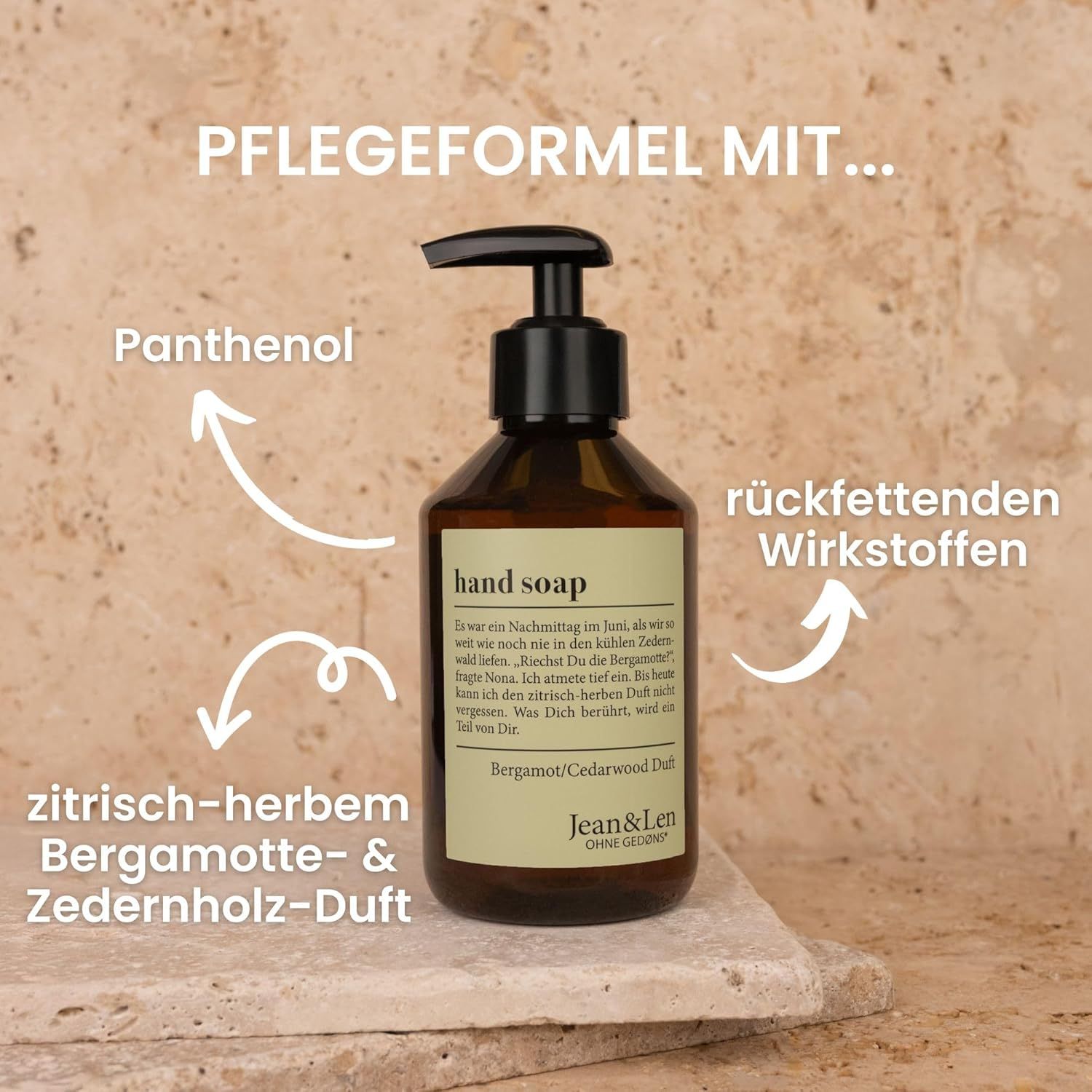 Flacon brun avec pompe noire. Inscription : hand soap, parfum Bergamot/Cedarwood. Logo Jean & Len. Flèches pointant vers les ingrédients.