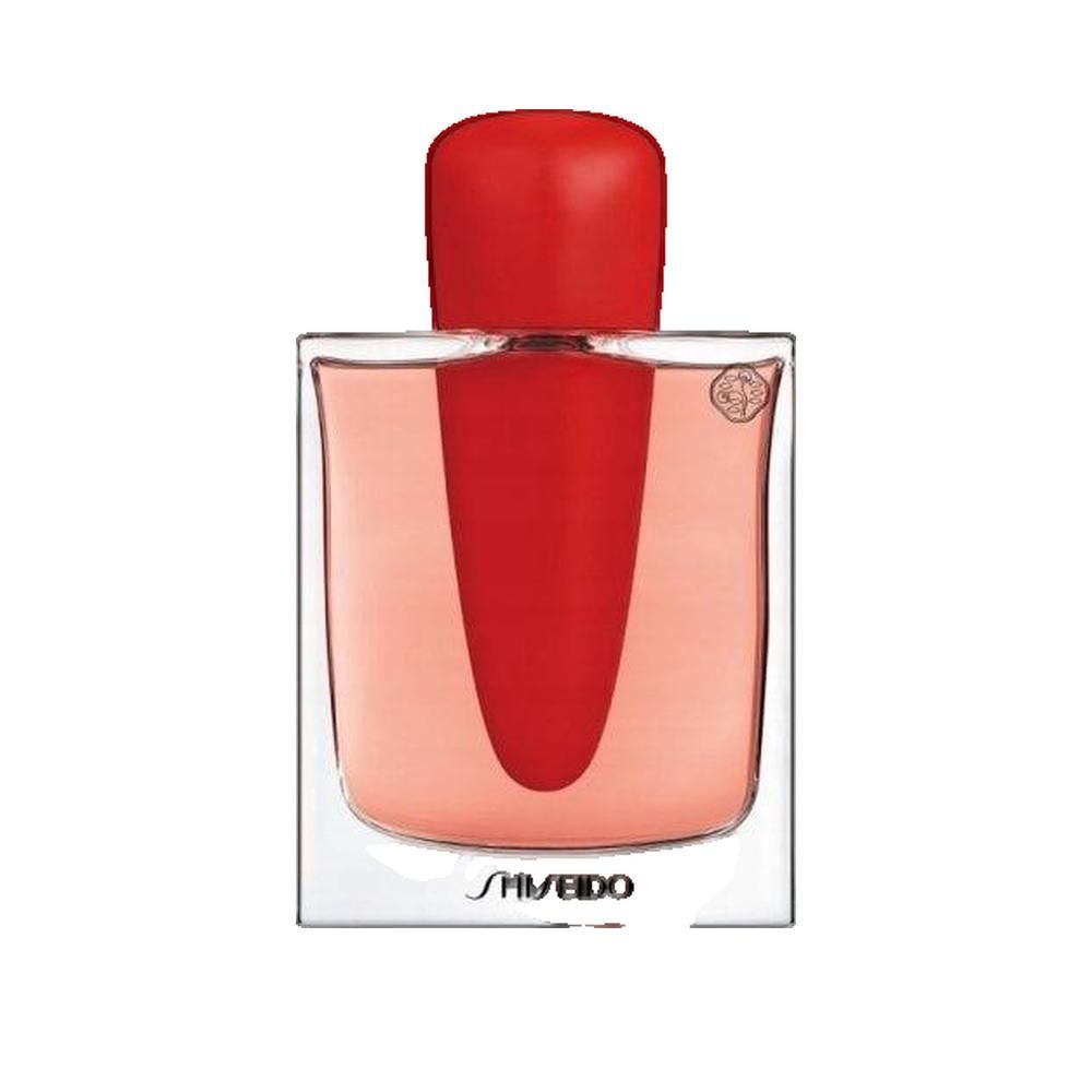 Flacon de parfum avec bouchon rouge. Flacon transparent carré avec liquide rose. Logo Shiseido en bas.