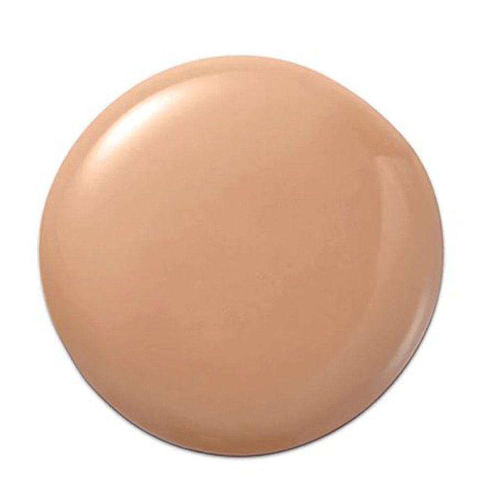 Beige make-up druppel. Ronde vorm. Glanzend oppervlak. Op witte achtergrond.