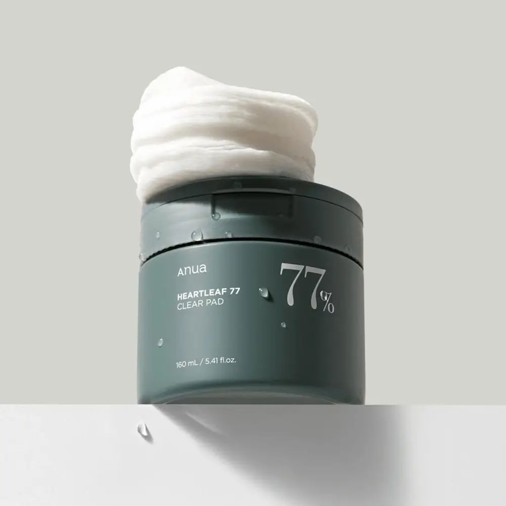 Groene pot met pads. Pads op het deksel. Opschrift: 77%.