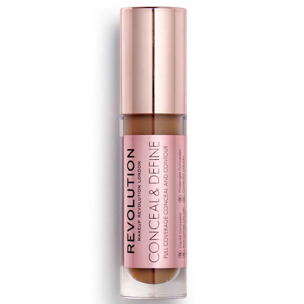 Tube de correcteur avec bouchon or rose. Marque et nom visibles.