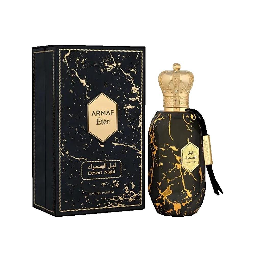 Flacon de parfum et emballage. Flacon noir avec détails dorés et bouchon doré. Emballage noir avec motif marbré et logo.