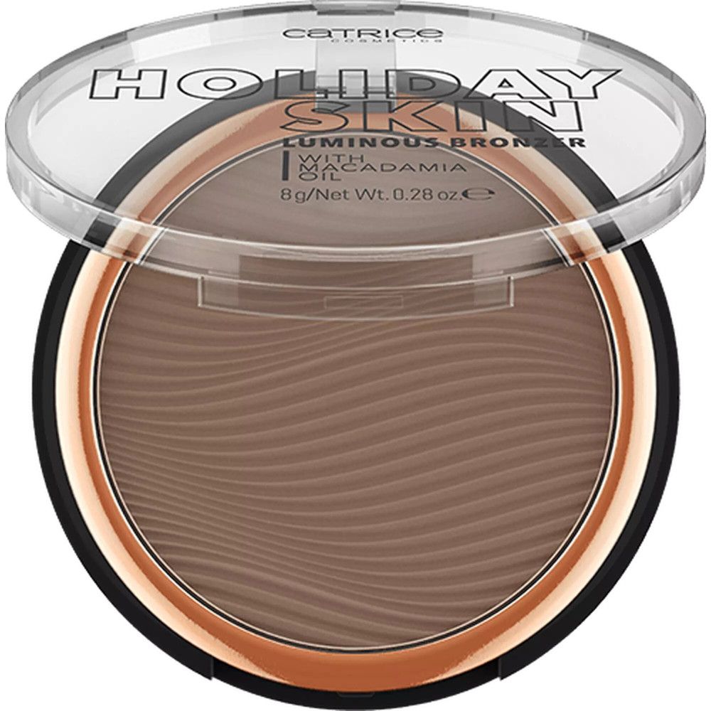 Ronde compacte bronzer met deksel. Opschrift: Holiday Skin Luminous Bronzer. Met Macadamia Oil. Inhoud: 8g/Net Wt. 0.28 oz e.