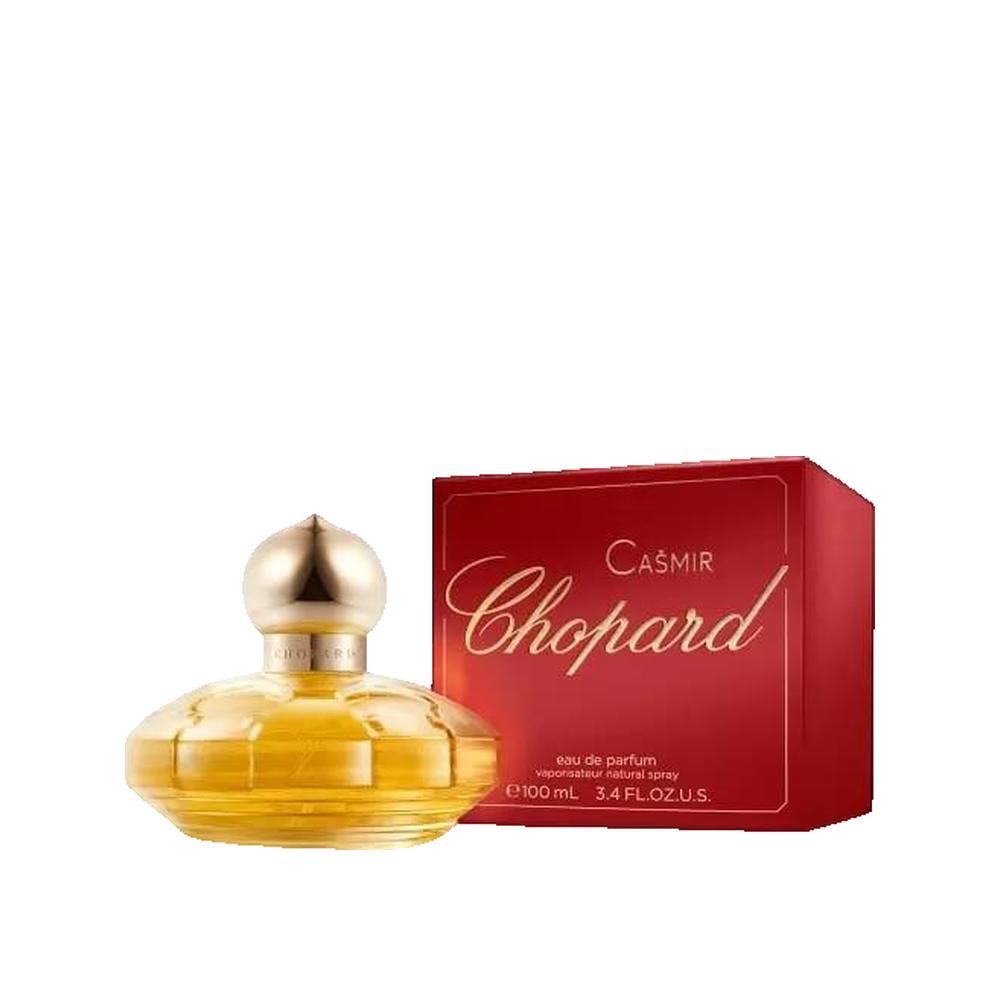 Geel parfumflesje met gouden dop en rode verpakking. Opschrift: Casmir Chopard.