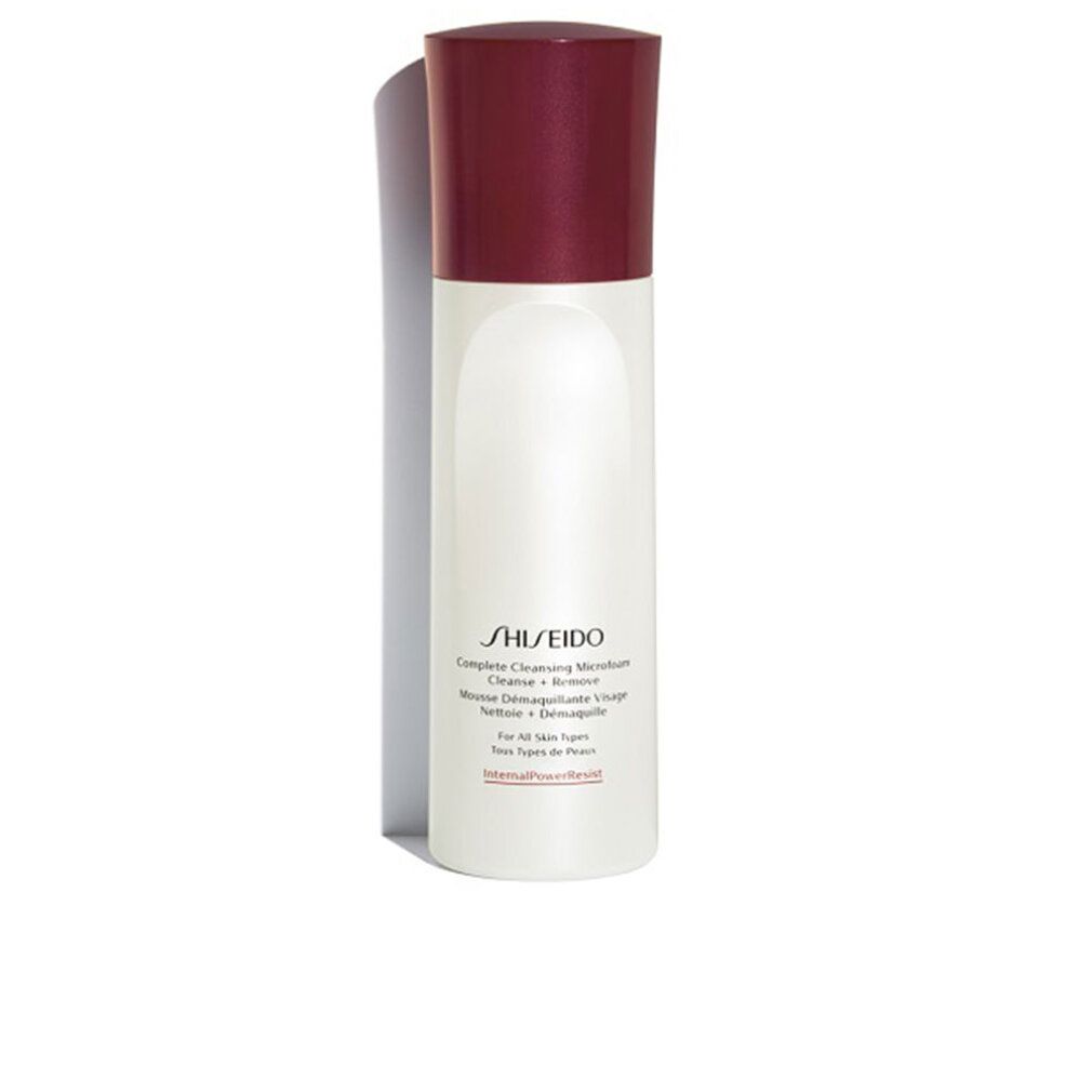 Flacon blanc et rouge Shiseido Microfoam nettoyant. Forme cylindrique, bouchon rouge. Texte: Complete Cleansing Microfoam.