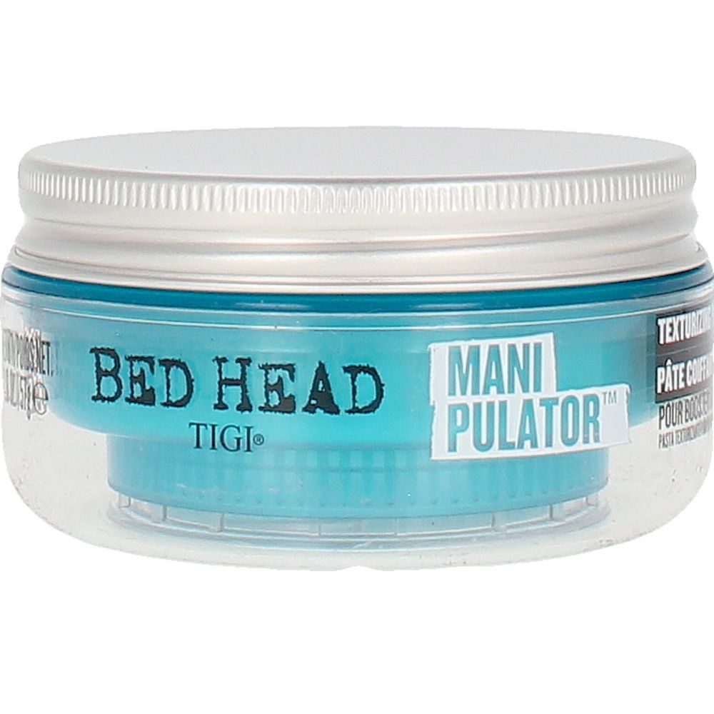 Tigi Bed Head Manipulator Matte Paste. Pot rond avec contenu bleu et couvercle argenté. Récipient transparent.