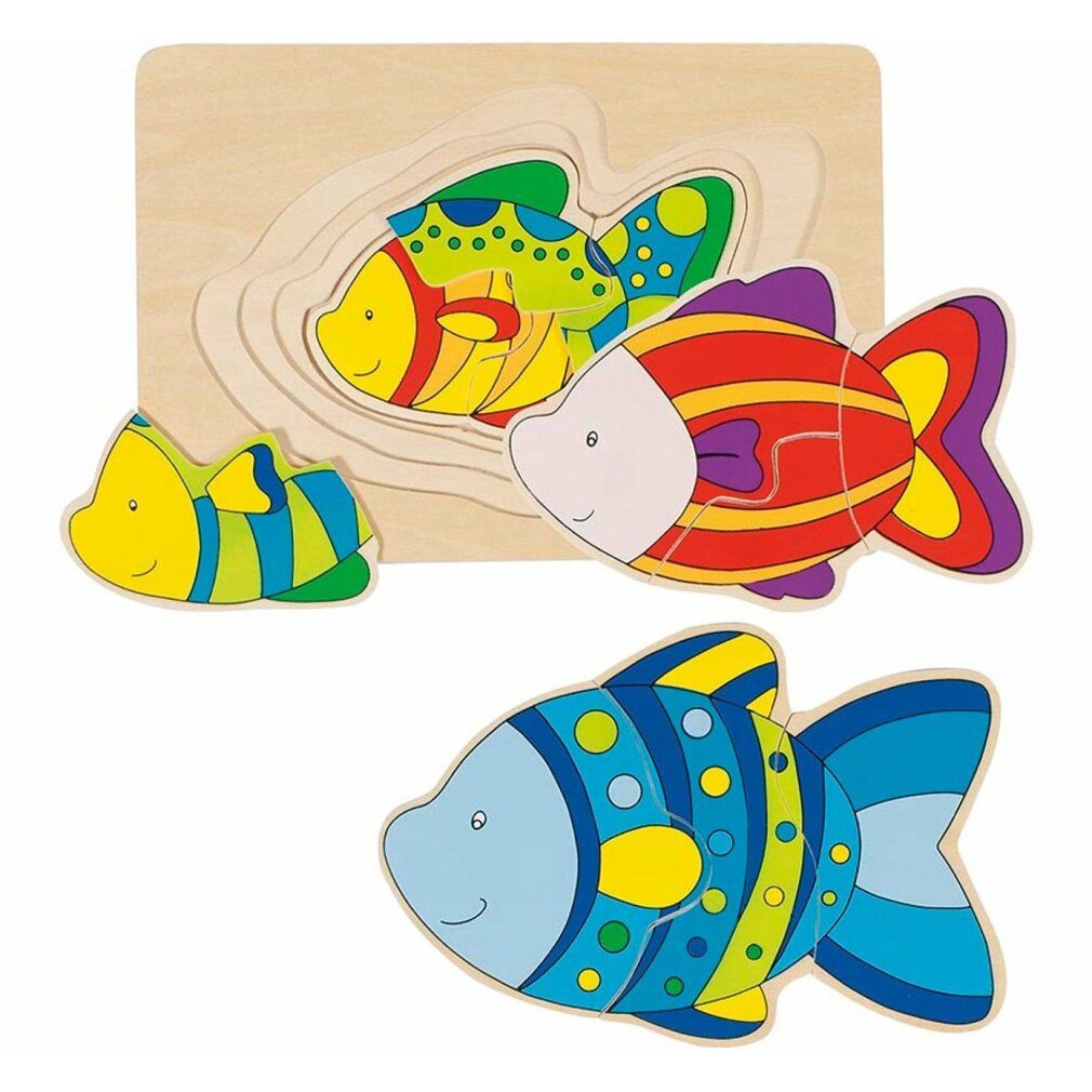 Puzzle en bois avec trois poissons colorés. Un poisson dans un cadre à trois couches, deux autres poissons à côté. Base en bois.