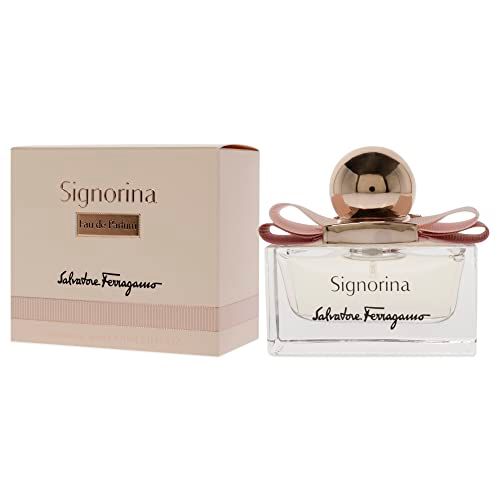 Signorina Eau de Parfum Spray. Rechthoekige glazen fles met roze vloeistof, roze strik en gouden dop. Verpakking ernaast.